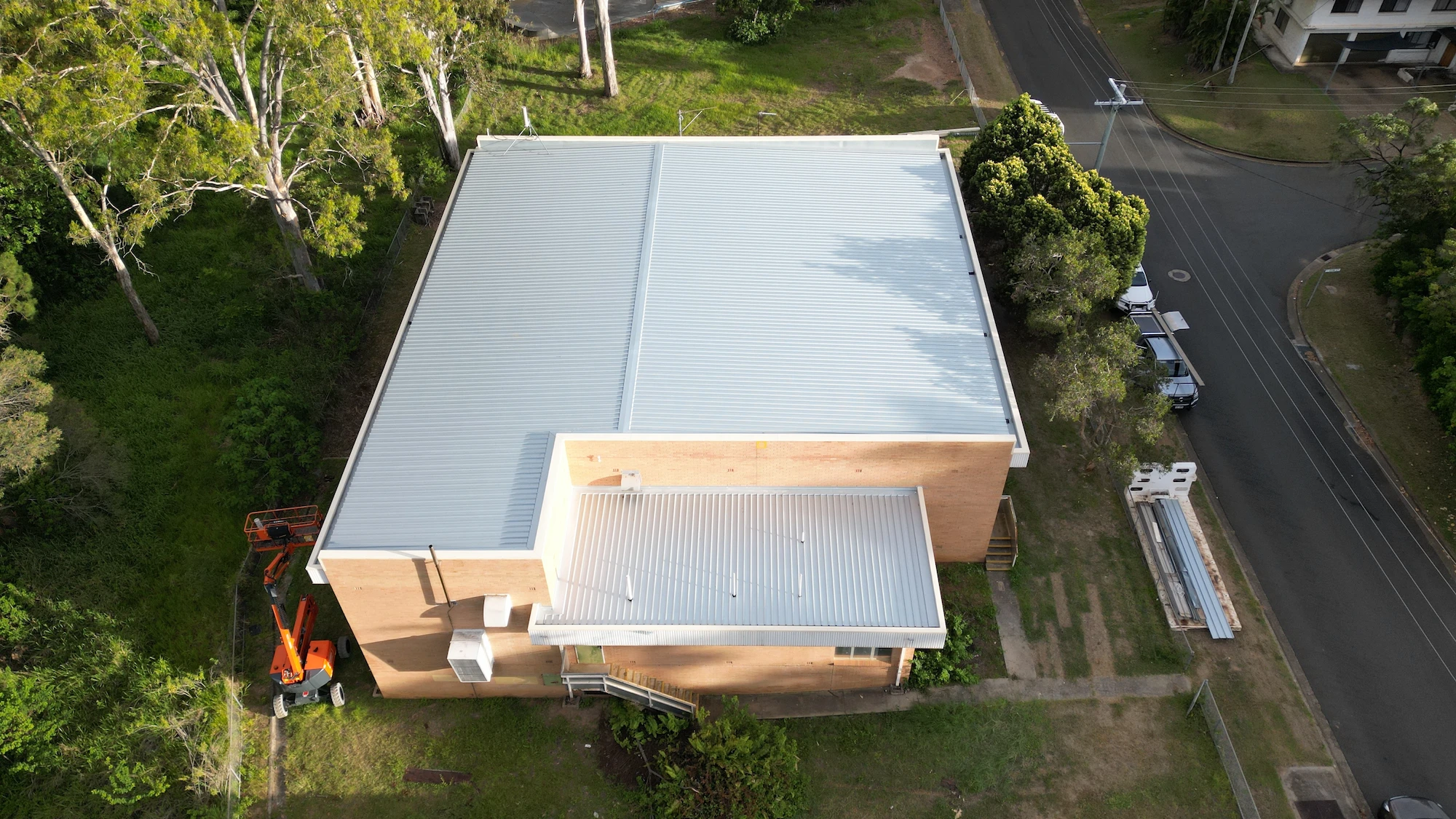 Aerial view of the new roof on the brick telecommunications exchange