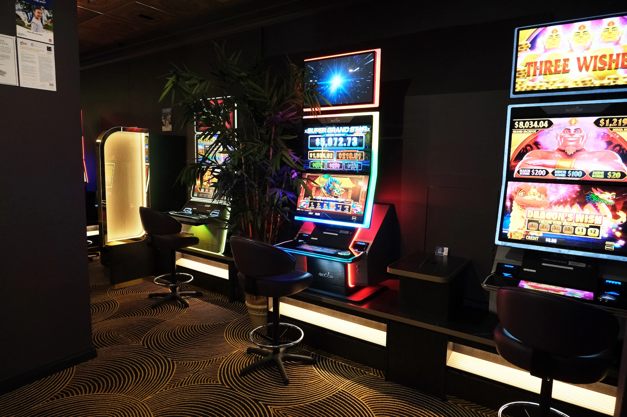 Refurbished gaming room at Websters Bar with gaming machines and backlit custom joinery